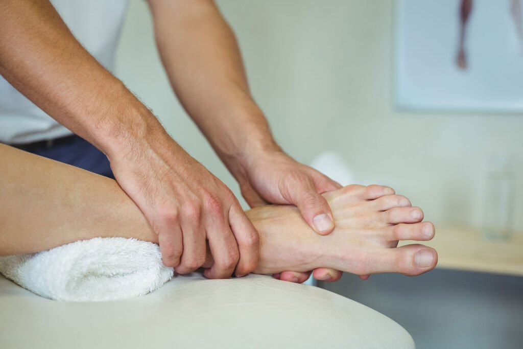 Massaging foot at E3 Physio